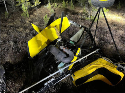 Photograph 2 – View of the empennage and the engine at the accident site, from the NTSB investigation of Amateur-built Dominator accident near Gilbert, Minnesota, November 15, 2024