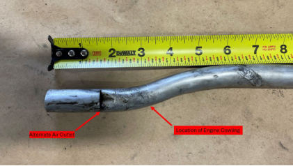 PG 5 Photograph 4 – Engine oil breather tube with alternate air outlet and location of engine cowling, from the NTSB investigation of Piper PA-28R-200 accident near Boscobel, Wisconsin, December 2, 2024