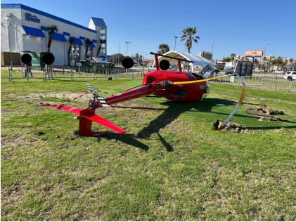 Photograph 3 – View of the rear of the helicopter at the accident site, from the NTSB investigation of Robinson Helicopter R44 accident near Galveston, Texas, December 31, 2024