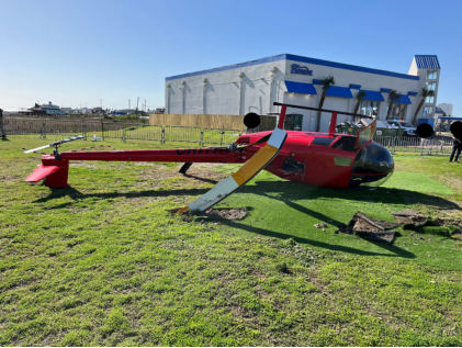 Photograph 4 – View of the top of the helicopter at the accident site, from the NTSB investigation of Robinson Helicopter R44 accident near Galveston, Texas, December 31, 2024