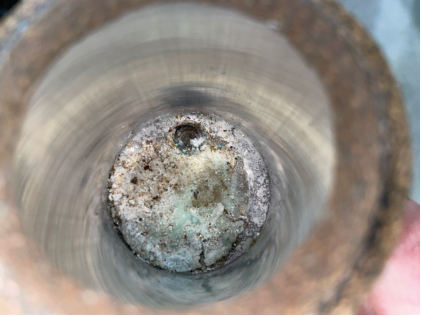 Photograph 6 – Fuel strainer bowl contaminants, from the NTSB investigation of Piper PA-24-250 accident near Bentonville, Arkansas, January 16, 2025