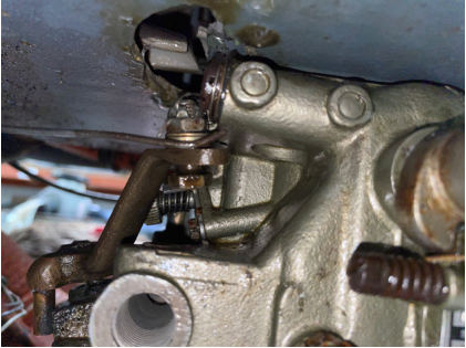 Photograph 7 – Mixture control cable and carburetor, from the NTSB investigation of Piper PA-24-250 accident near Bentonville, Arkansas, January 16, 2025