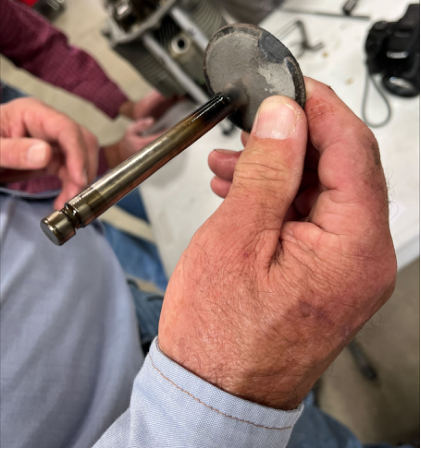 Photograph 3 – Damaged Number 3 Cylinder Intake Valve, from the NTSB investigation of Robinson Helicopter R22 BETA accident near Spearman, Texas, February 7, 2025