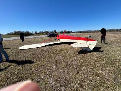 Photograph 9 – Rear view of N39158 Taylorcraft BC-12D inverted on a grass field, from the NTSB investigation of Taylorcraft BC12 accident near Russellville, Arkansas, March 22, 2025