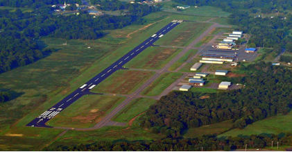 Photograph 1 – Aerial view of the accident airport, looking to the southwest, from the NTSB investigation of Taylorcraft BC12 accident near Russellville, Arkansas, March 22, 2025