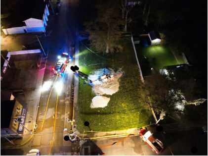 Photograph 1 – Aerial view of the accident site at night, from the NTSB investigation of Messerschmitt-Bolkow-Blohm BK 117 accident near Hartford, Illinois, April 25, 2025