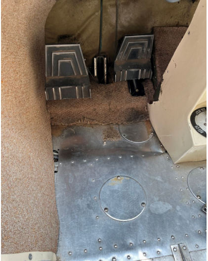 Photograph 4 – View of the lower left side of the cockpit, from the NTSB investigation of Cessna 182 accident near Charlevoix, Michigan, June 2, 2025