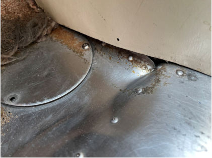 Photograph 5 – View of the lower left side of the cockpit, from the NTSB investigation of Cessna 182 accident near Charlevoix, Michigan, June 2, 2025
