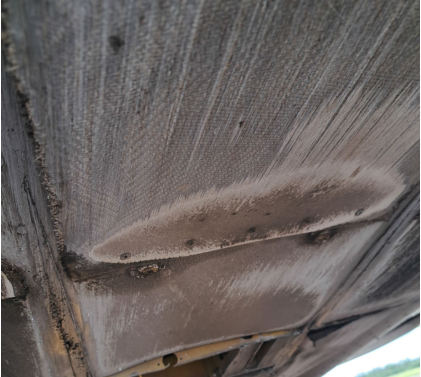 Photograph 1 – Damage to underside of fuselage, from the NTSB investigation of Piper PA-24-260 accident near Ashland, Wisconsin, June 24, 2025
