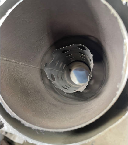 Photograph 5 – Accident airplane muffler (NTSB Photo), from the NTSB investigation of Tecnam P2010 accident near Temple, Texas, June 26, 2025
