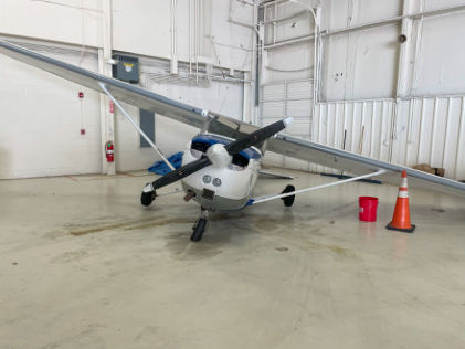 Photograph 2 – View of the front of the airplane inside of a hangar, from the NTSB investigation of Cessna 172 accident near Wichita, Kansas, June 28, 2025