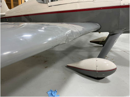 Photograph 5 – View of the right wing of the airplane inside of a hangar, from the NTSB investigation of Van'S Aircraft RV-6 accident near New Richmond, Wisconsin, July 17, 2025