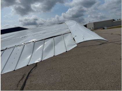Photograph 2 – Right wing damage, from the NTSB investigation of Cessna A185F accident near Lansing, Michigan, July 19, 2025