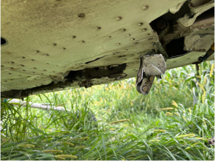 Photograph 2 – Lower Fuselage Substantial Damage, from the NTSB investigation of Cessna 210 accident near Markesan, Wisconsin, August 21, 2025