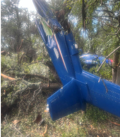 Photograph 5 – View of the empennage at the accident site, from the NTSB investigation of Sikorsky Aircraft CORP S-76 accident near Round Mountain, Texas, September 1, 2025