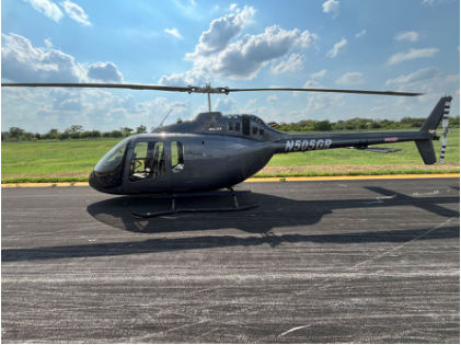 Photograph 2 – View of the left side of the helicopter at the heliport, from the NTSB investigation of Bell Helicopter Textron Canada 505 accident near Fort Worth, Texas, August 27, 2025