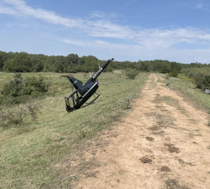 Photograph 1 – Helicopter at accident site (FAA photo), from the NTSB investigation of Robinson Helicopter R44 accident near Decatur, Texas, September 19, 2025