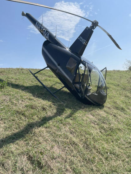 Photograph 2 – Helicopter at accident site (FAA photo), from the NTSB investigation of Robinson Helicopter R44 accident near Decatur, Texas, September 19, 2025