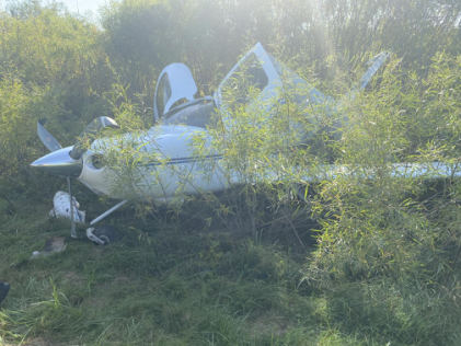 Photograph 2 – Front left of airplane at the accident site, from the NTSB investigation of Cirrus SR20 accident near Watertown, Wisconsin, September 30, 2025