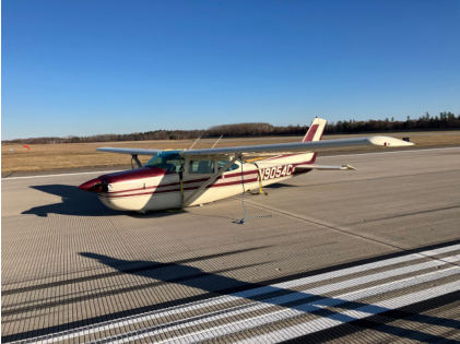 Photograph 1 – Airplane on the runway with gear retracted, from the NTSB investigation of Cessna R182 accident near Brainerd, Minnesota, November 5, 2025