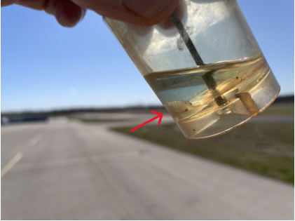 Photograph 5 – View of the fuel sample, from the NTSB investigation of Cessna 172 accident near Taylor, Texas, December 26, 2025