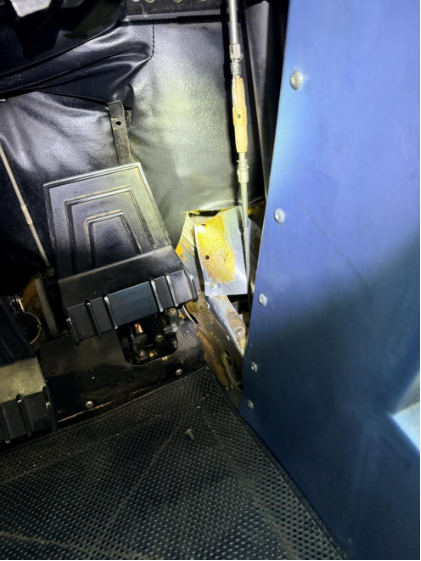 Photograph 1 – View of the substantial damage sustained to the lower fuselage near the cockpit, from the NTSB investigation of Cessna 172 accident near San Marcos, Texas, January 7, 2026