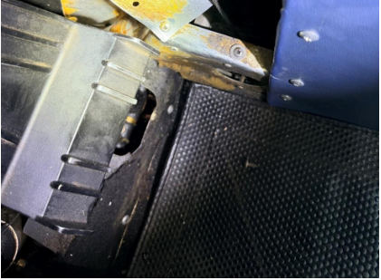 Photograph 2 – View of the substantial damage sustained to the lower fuselage near the cockpit, from the NTSB investigation of Cessna 172 accident near San Marcos, Texas, January 7, 2026