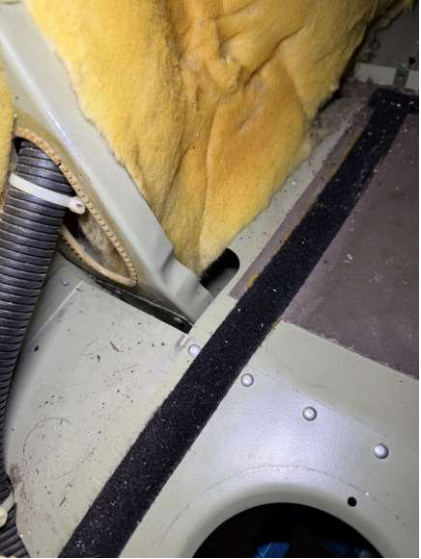 Photograph 1 – Fuselage damage – floor is bowed, from the NTSB investigation of Cessna 172S accident near Denver, Colorado, February 28, 2026