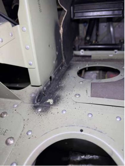 Photograph 2 – Fuselage damage – floor is bowed, from the NTSB investigation of Cessna 172S accident near Denver, Colorado, February 28, 2026