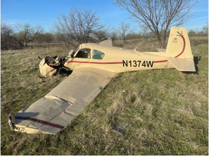 Photograph 2 – View of the left side of the airplane at the accident site, from the NTSB investigation of Mooney M20 accident near Northlake, Texas, March 18, 2026