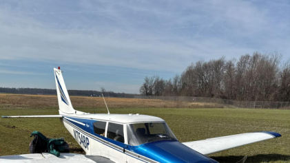 Photograph 1 – N7548P in field, from the NTSB investigation of Piper PA-24-250 accident near Madison, Indiana, March 21, 2026