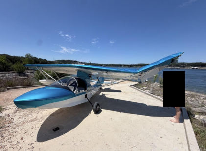 Photograph 1 – N379GG with substantial damage to the left wing, from the NTSB investigation of Amateur-built SEAREY LSX accident near Briarcliff, Texas, May 24, 2026