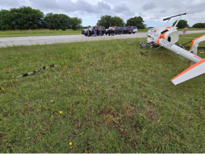 Photograph 1 – Helicopter at site from rear, from the NTSB investigation of Robinson Helicopter CO R66 accident near Fort Worth, Texas, May 27, 2026