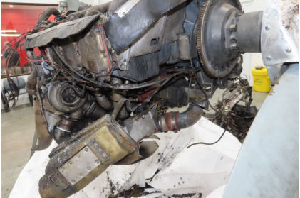 Photograph 7 – Overall engine condition after recovery. Note turbo condition. (NTSB), from the NTSB investigation of Piper PA32RT accident near Nashville, Tennessee, March 5, 2024