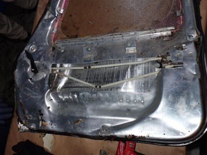 Photograph 5 – Main cabin door after partial disassembly, from the NTSB investigation of Mooney M20K accident near St. Augustine, Florida, March 25, 2024