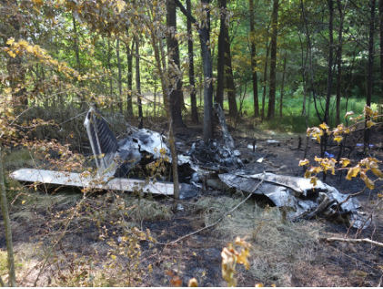 Photograph 1 – Main wreckage at accident site., from the NTSB investigation of Piper PA28 accident near Siler City, North Carolina, June 14, 2024