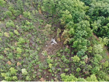 Photograph 1 – Aerial view of accident site and wreckage, from the NTSB investigation of Cessna 182 accident near Rutherfordton, North Carolina, July 8, 2024