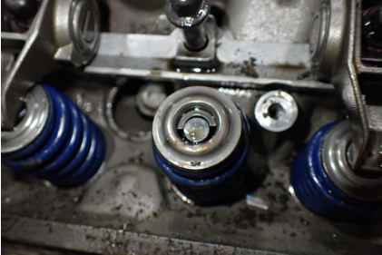 Photograph 9 – No. 3 intake valve missing one valve key, from the NTSB investigation of Williams John TITAN T-51 MUSTANG accident near Geneva, Ohio, July 21, 2024