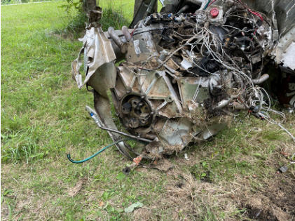 Photograph 2 – Engine at accident site, from the NTSB investigation of Williams John TITAN T-51 MUSTANG accident near Geneva, Ohio, July 21, 2024