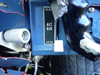 Photograph 7 – Engine alternate air door control, from the NTSB investigation of Piper PA28R accident near Vergennes, Vermont, September 8, 2024