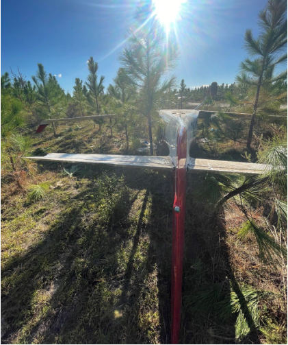 Photograph 3 – View of inverted airplane from rear., from the NTSB investigation of Amateur-built IV accident near Perry, Florida, November 17, 2023