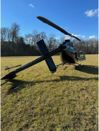 Photograph 1 – Helicopter damage at the accident site., from the NTSB investigation of Bell Helicopter Textron 206L-1 accident near Walland, Tennessee, December 28, 2023