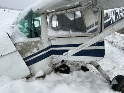 Photograph 3 – Left side of fuselage damage. Note, snow occurred post-accident., from the NTSB investigation of Cessna 150M accident near Franklin, Pennsylvania, January 15, 2024