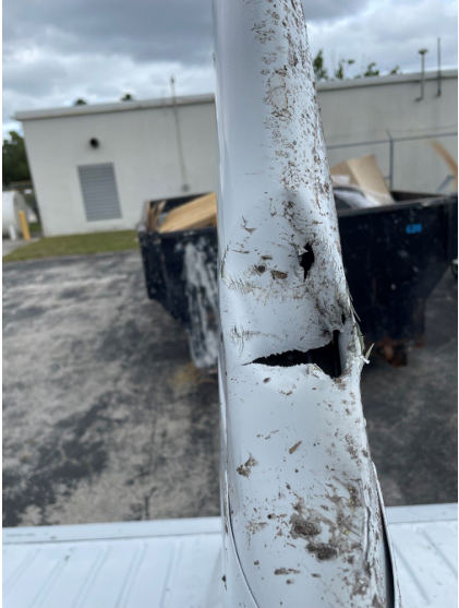 Photograph 4 – Damage to the vertical stabilizer, from the NTSB investigation of Piper PA-32-301T accident near Palm Beach Gardens, Florida, February 7, 2024