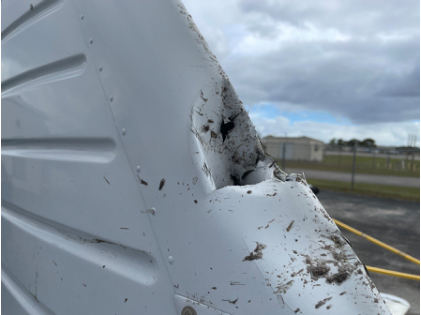 Photograph 5 – Damage to the vertical stabilizer, from the NTSB investigation of Piper PA-32-301T accident near Palm Beach Gardens, Florida, February 7, 2024