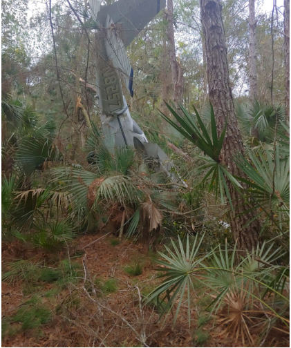 Photograph 1 – Airplane at accident site, from the NTSB investigation of Cessna 172 accident near Pierson, Florida, February 16, 2024
