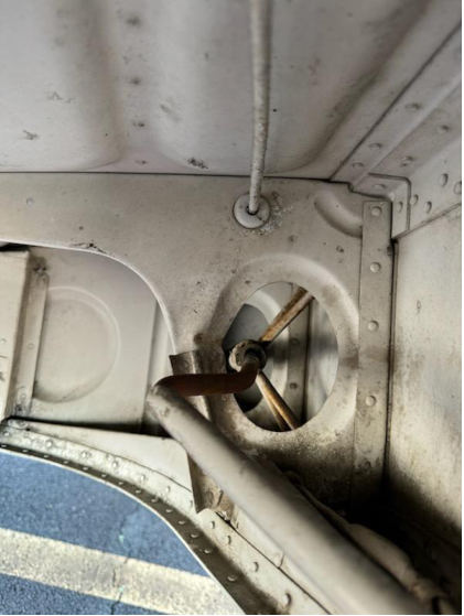 Photograph 5 – Bent right main landing gear push rod, from the NTSB investigation of Piper PA24 accident near Stafford, Virginia, March 7, 2024
