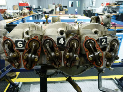 Photograph 4 – Engine, number 6,4,2 side. (NTSB), from the NTSB investigation of Cirrus Design CORP SR22 accident near Winokur, Georgia, March 16, 2024