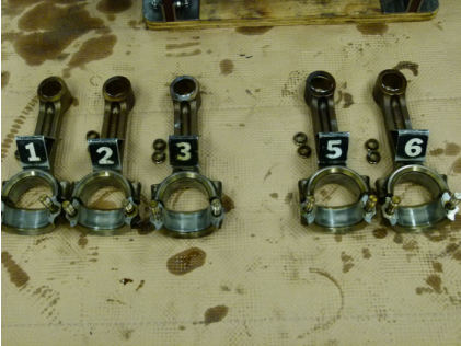 Photograph 5 – Remaining piston rods and bushings. (NTSB), from the NTSB investigation of Cirrus Design CORP SR22 accident near Winokur, Georgia, March 16, 2024