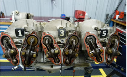 Photograph 6 – Engine, number 1,3,5 side. (NTSB), from the NTSB investigation of Cirrus Design CORP SR22 accident near Winokur, Georgia, March 16, 2024